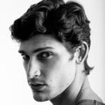 face of young handsome man looking back VQ5CDCZ 1